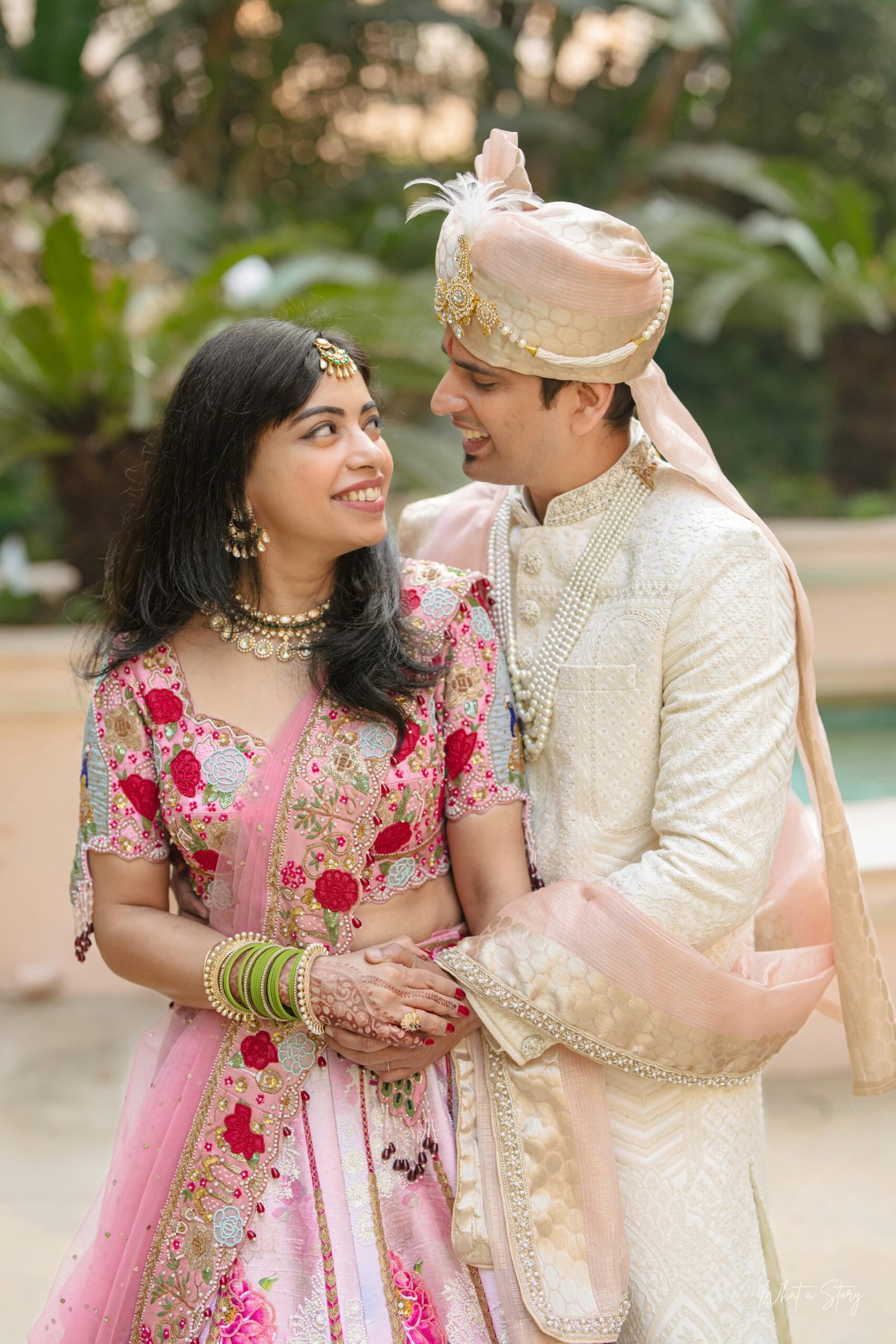 Services Smiling Indian couple in traditional wedding costumes celebrating their special day outdoors.